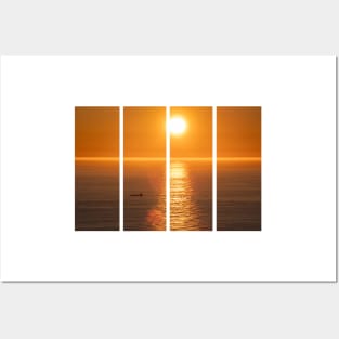 Wonderful landscapes in Norway. Nord-Norge. Beautiful scenery of a midnight sun sunset at Nordkapp (Cape North). Boat and globe on a cliff. Rippled sea and clear orange sky. Posters and Art